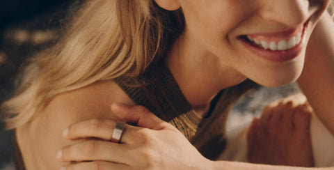 Woman wearing a smart ring while smiling in warm natural light | Smartring PH