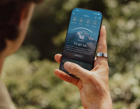Person holding a smartphone with a fitness app | Smartring PH
